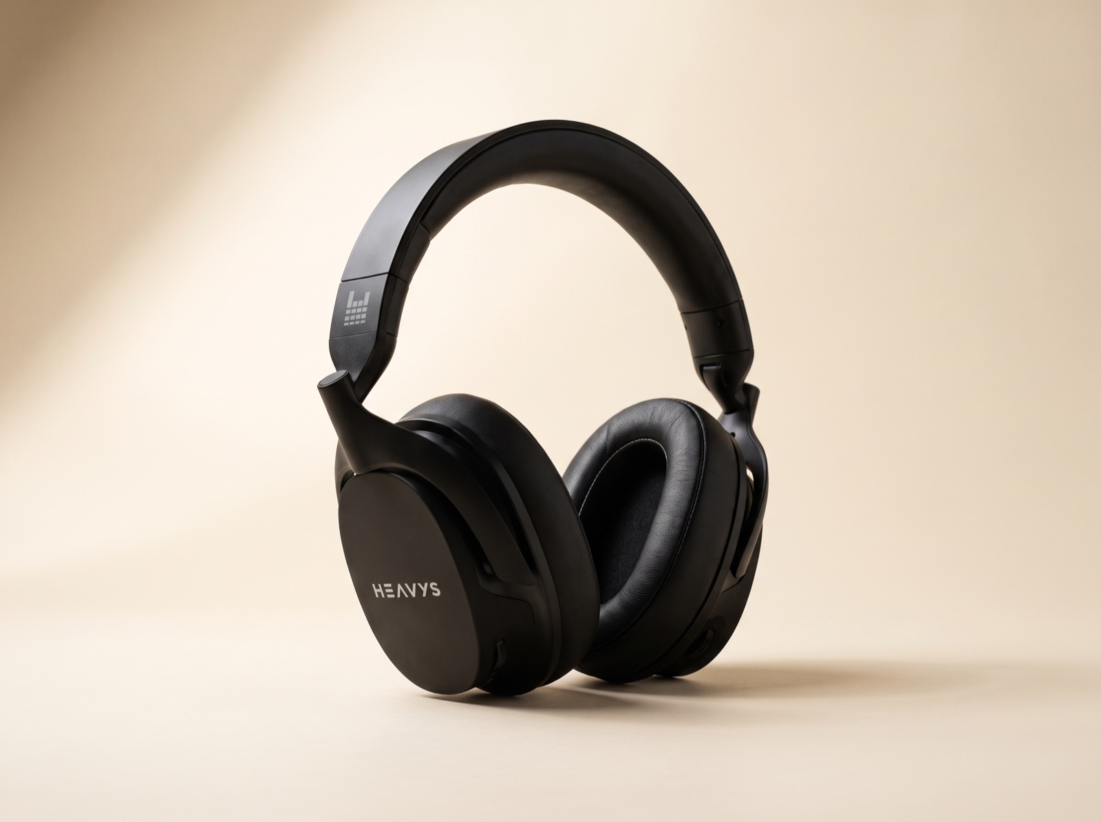 Heavys H1H headphones on a cream background, showing the deep around-ear cushions and padded headband
